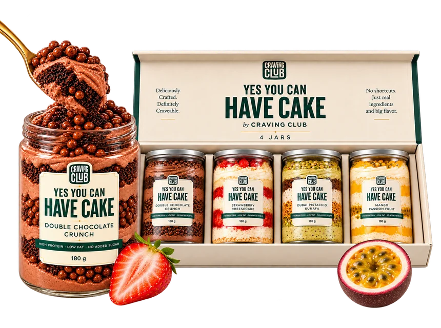 Double Chocolate Crunch jar beside an open Craving Club box of four YES YOU CAN HAVE CAKE jars, with strawberry and passion fruit